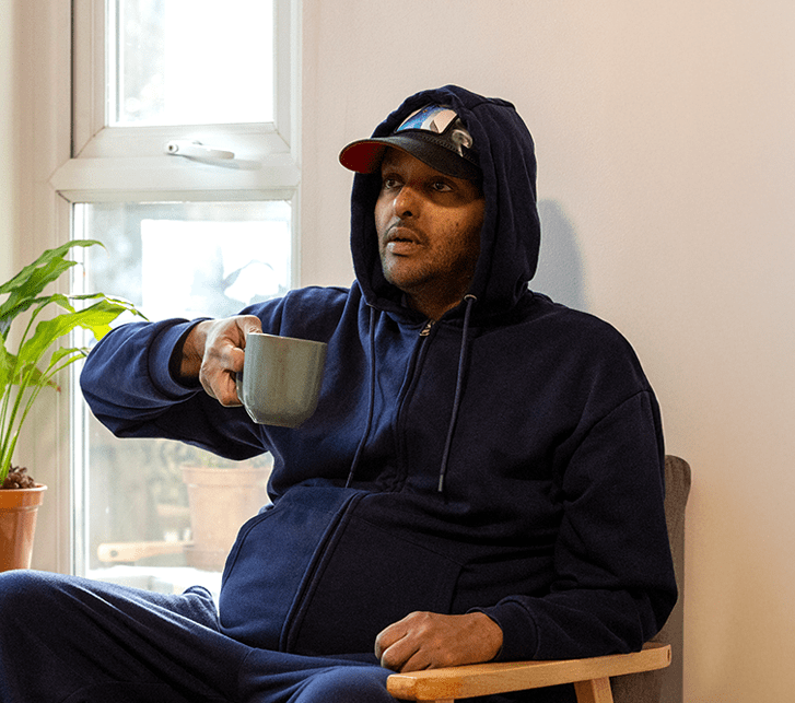 Service user having a cup of tea